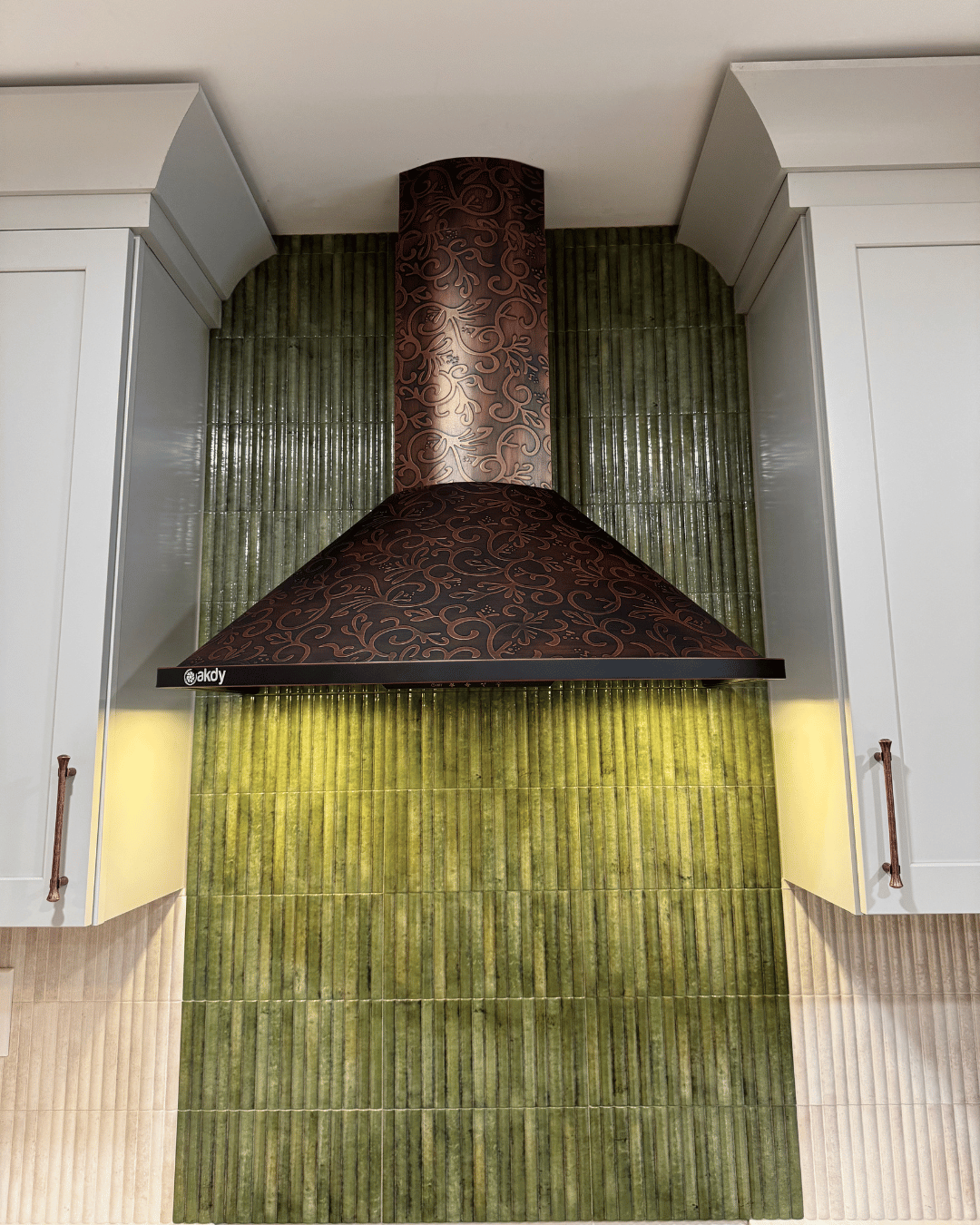 Kitchen Renovation with Green Tile and Copper-Color Hood