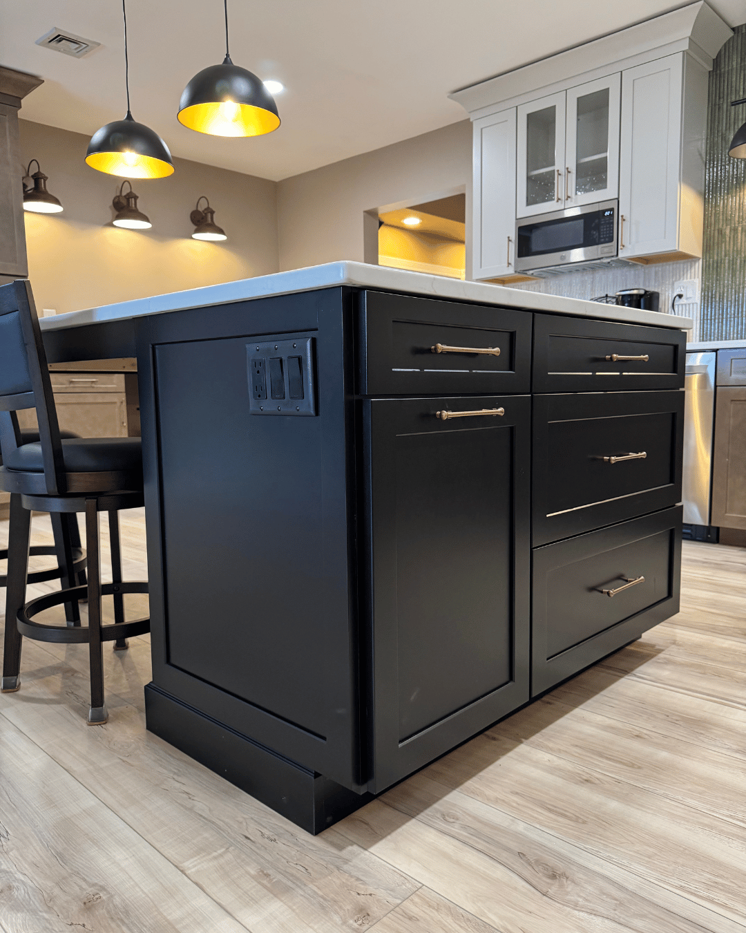 Modern Kitchen Renovation with New Flooring and Dark Cabinets.