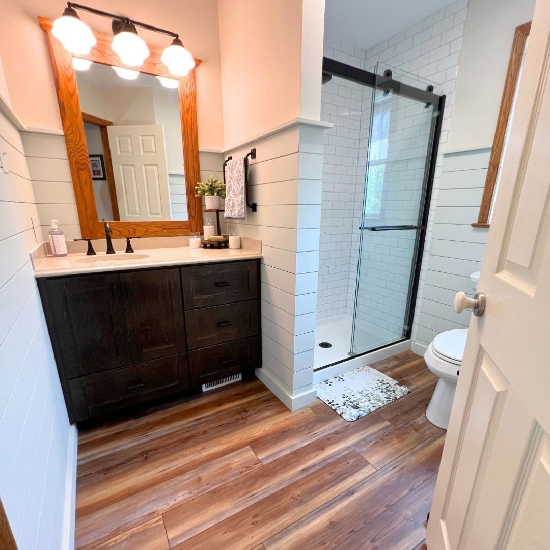 Remodeled Bathroom with Vanity and Wood Flooring and Finishes