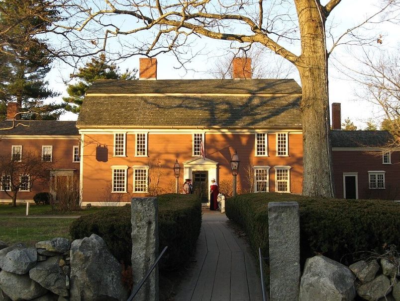 Image of large brick home at sunset in Sudbury, MA