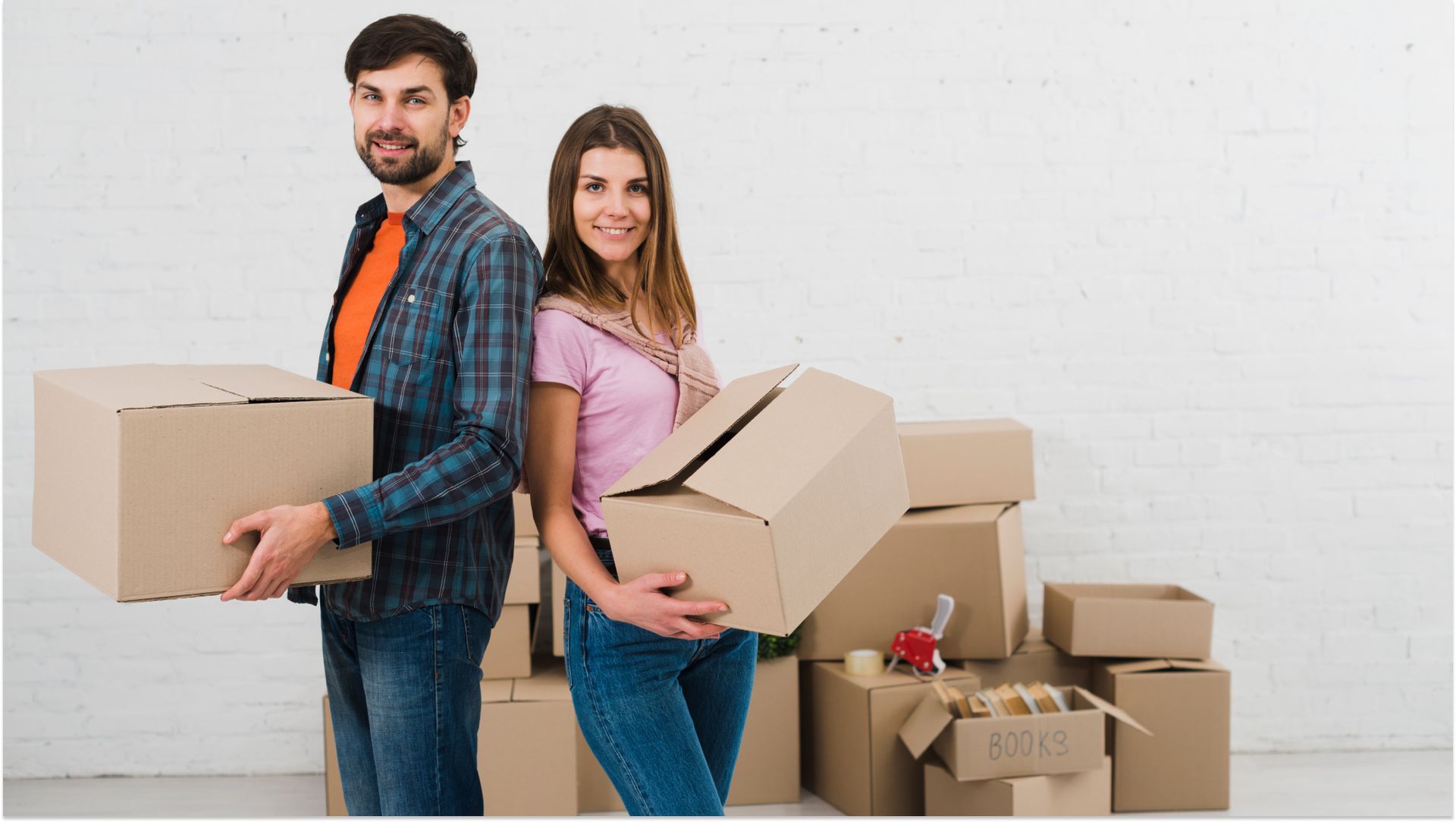 couple with backs together holding storage boxes