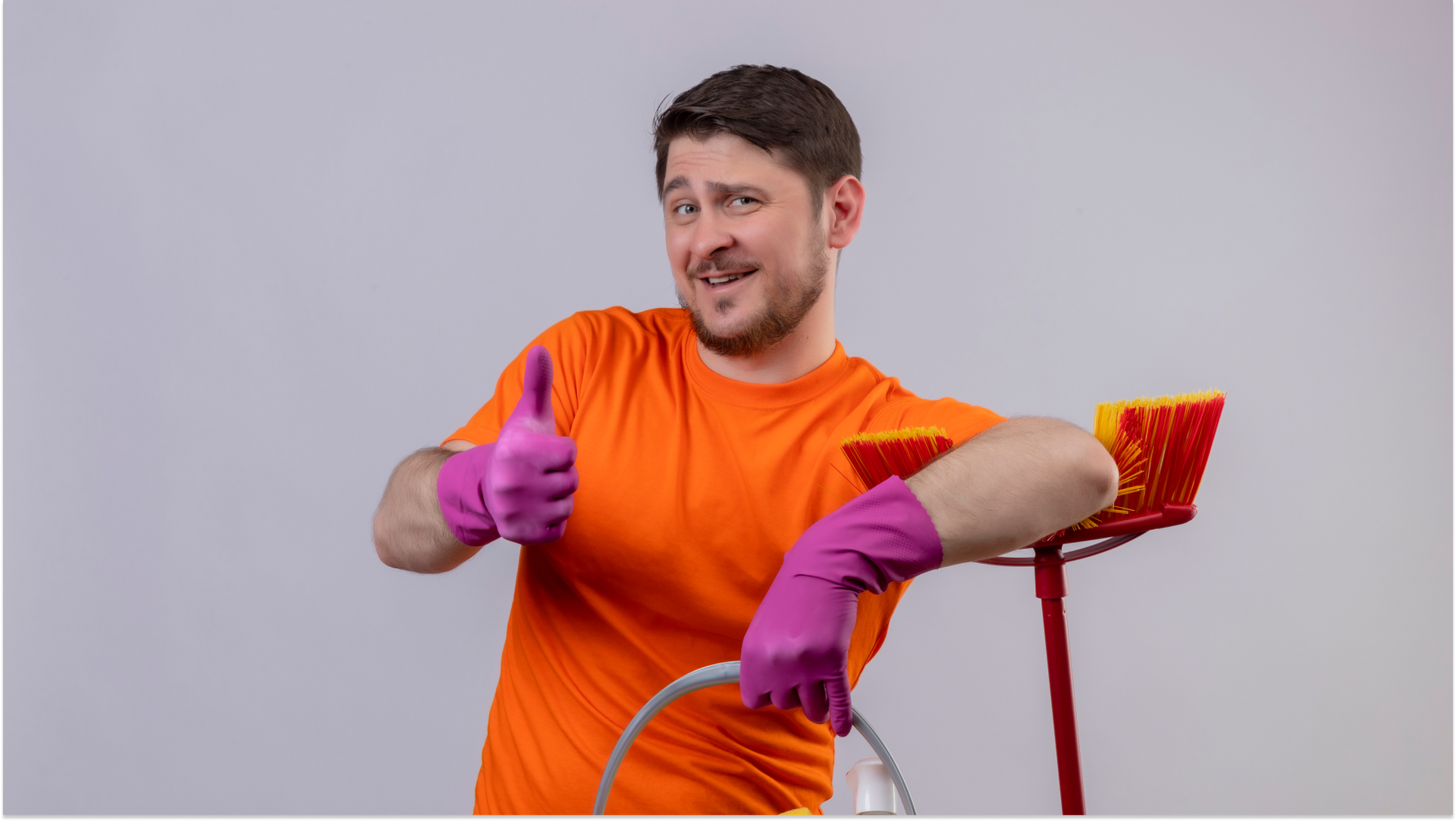 man cleaning with thumbs up