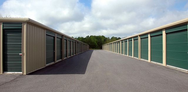 Drive-up storage units lining a paved aisle
