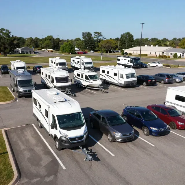 RVs parked in secure RV storage spaces at a Storage Outlet facility