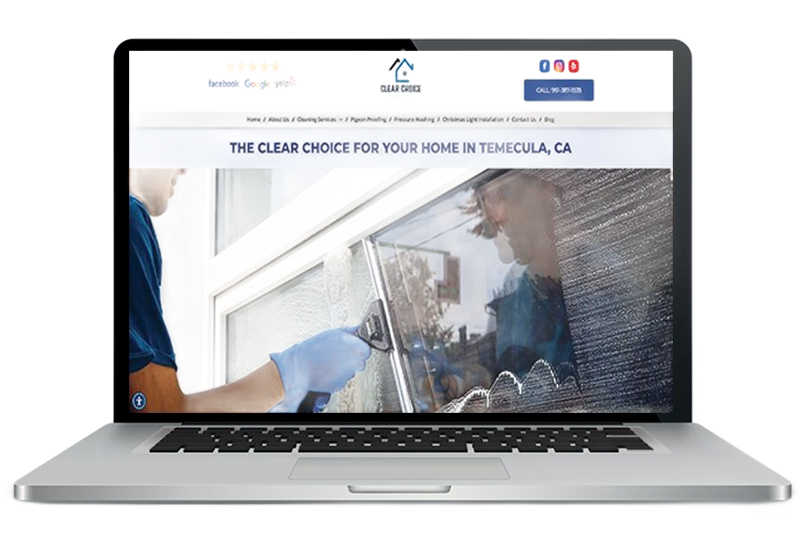Laptop displaying a window cleaning website with a person cleaning glass on the screen