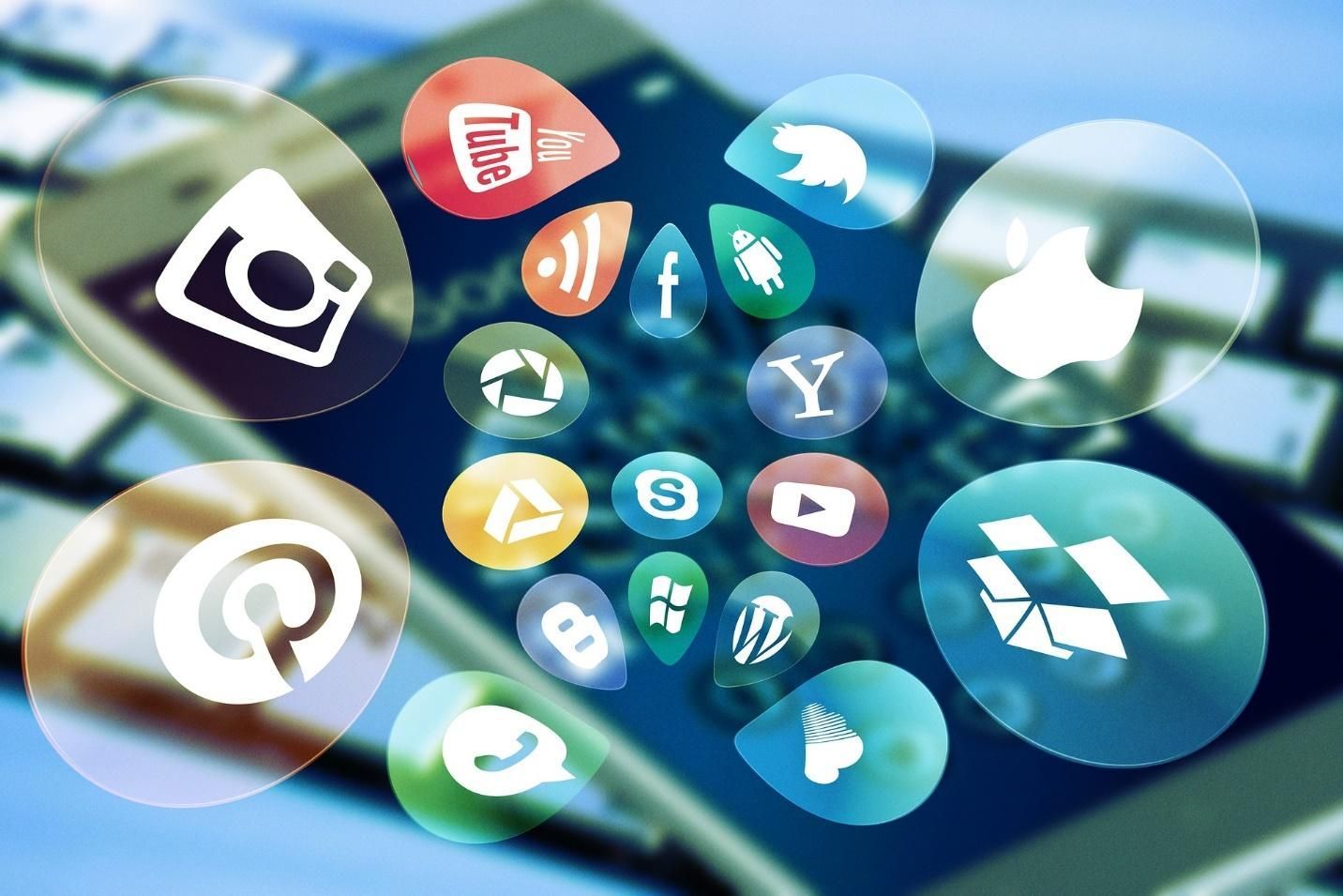 Smartphone screen overlaid with colorful social media icons.