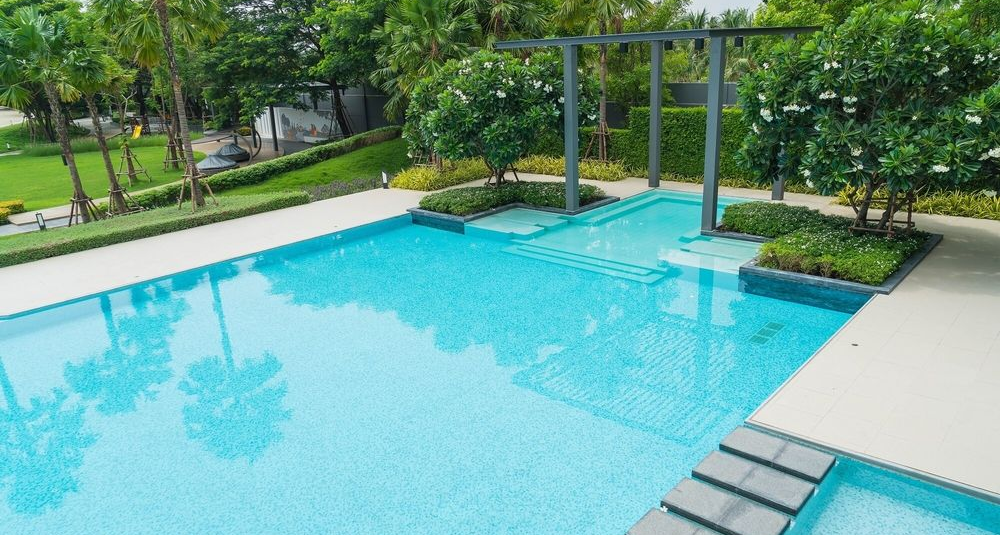 swimming pool connected to mini pool with pergola