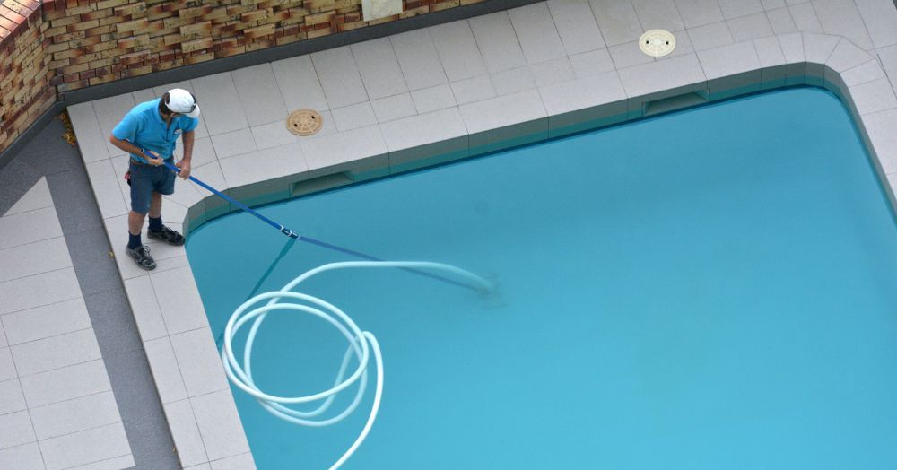 Pool Expert doing maintenance on pool