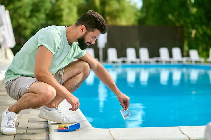 man with pH level Test toolkit
