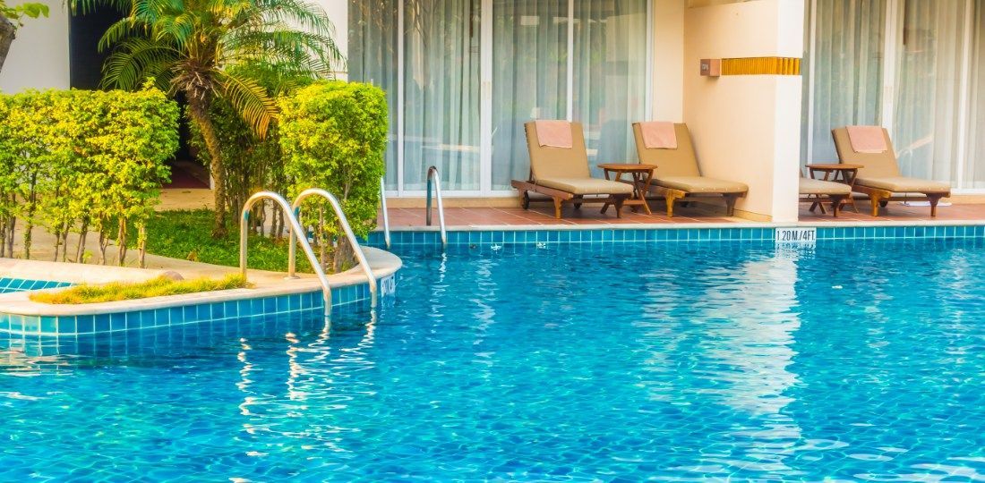 swimming pool with pool side chairs