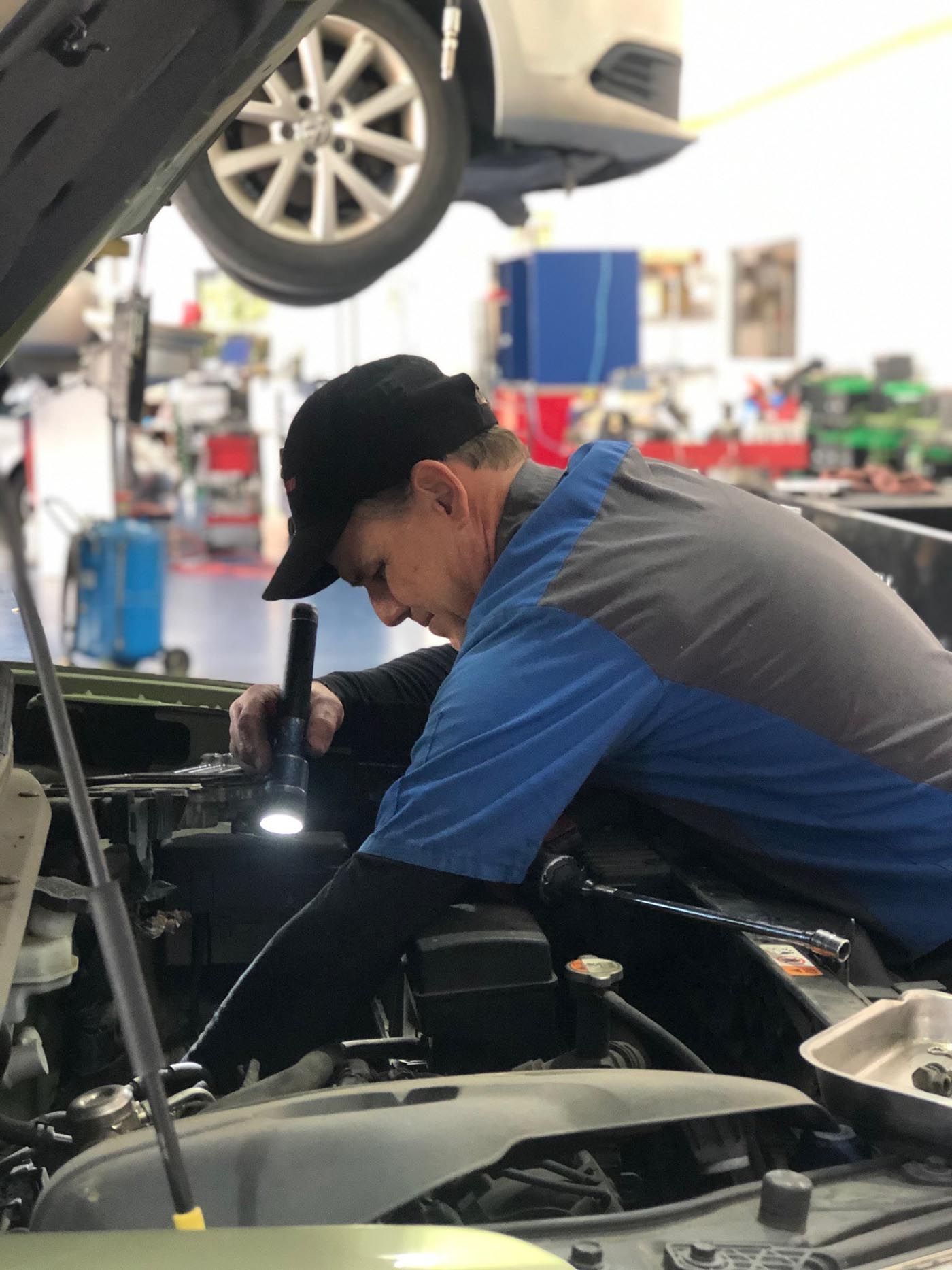 Mechanic Working on a Vehicle | Adams Automotive