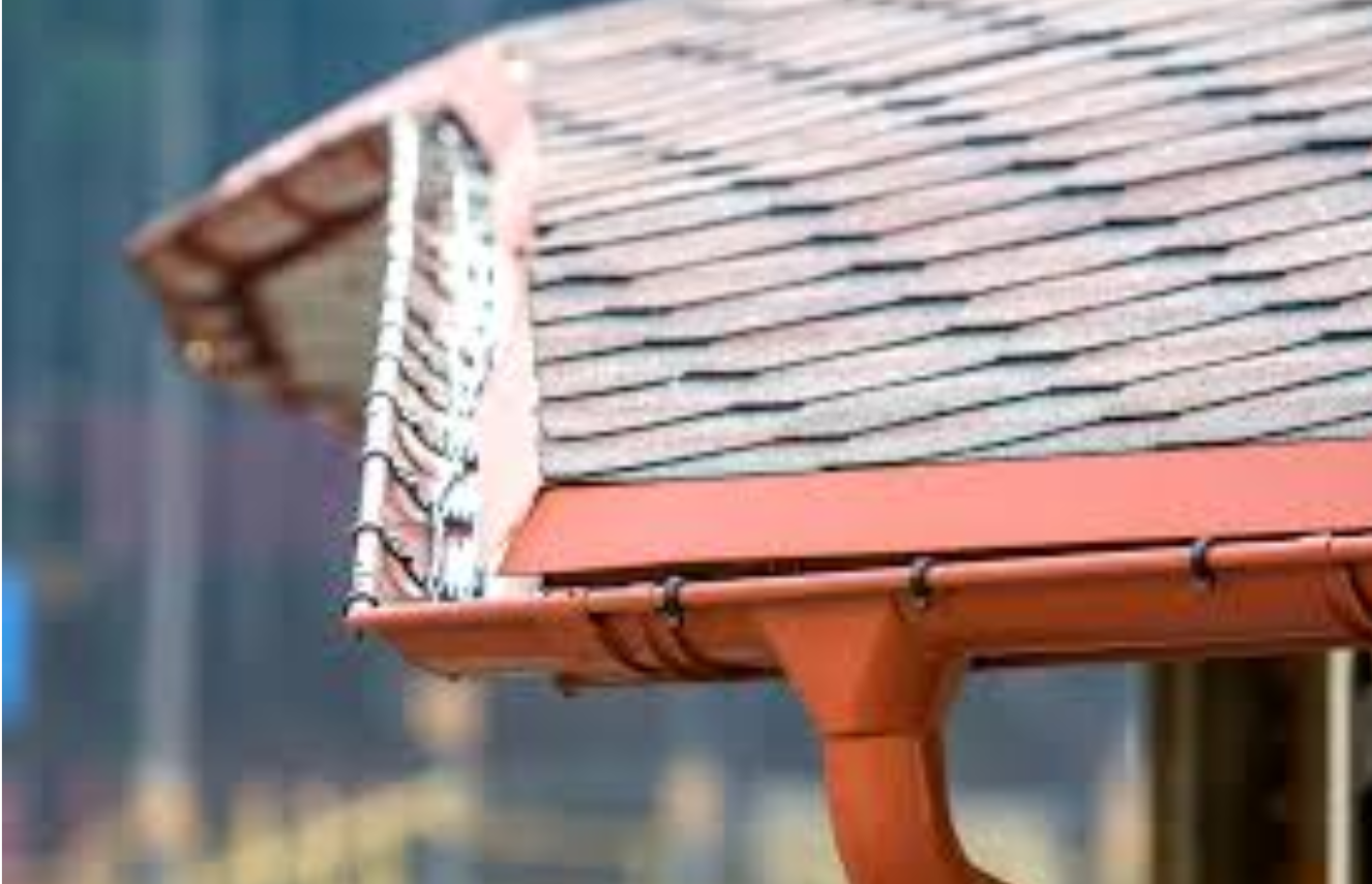 A close up of a gutter on an improperly slanted roof of a house.