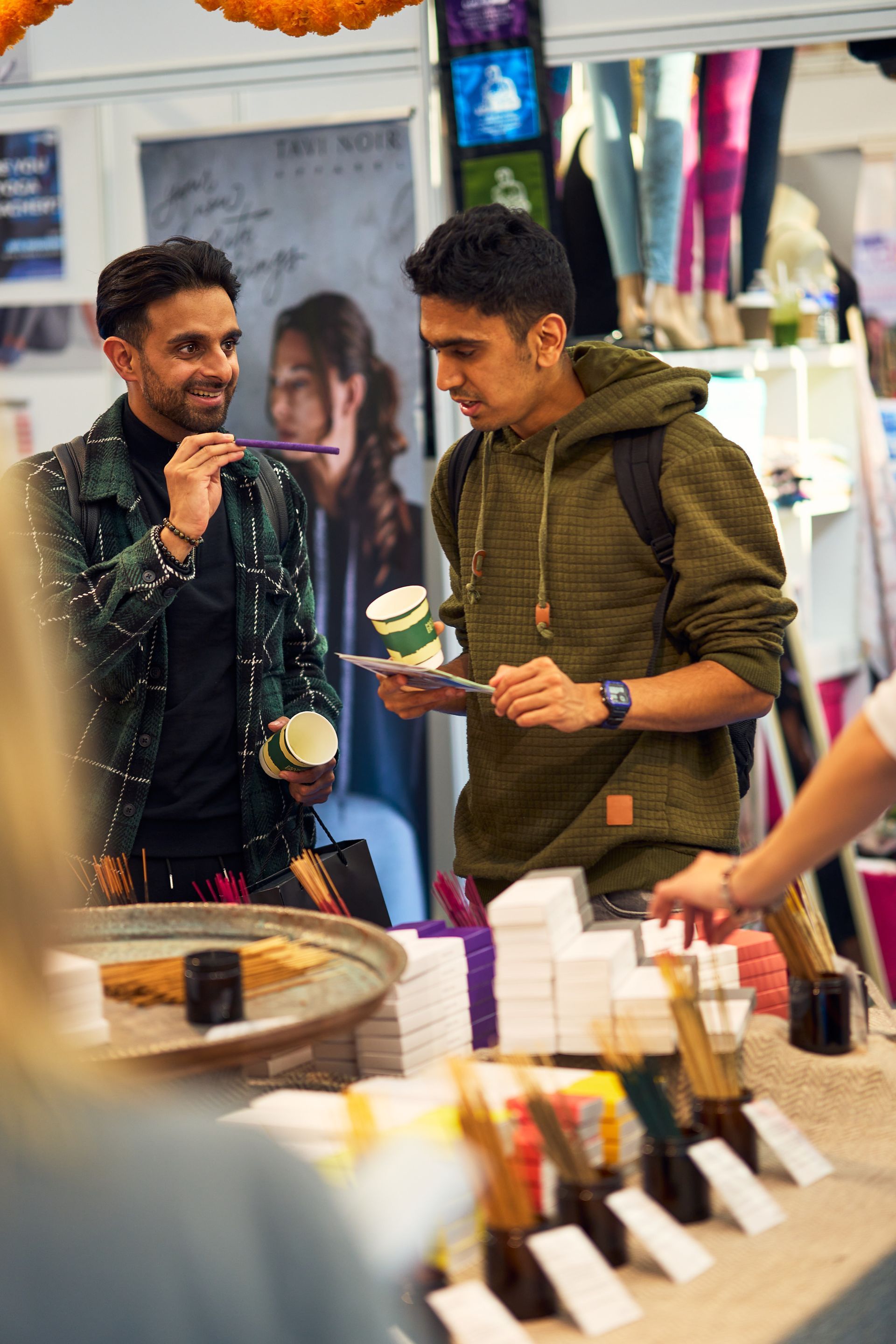 Visitors browsing the marketplace at OM Yoga Show London
