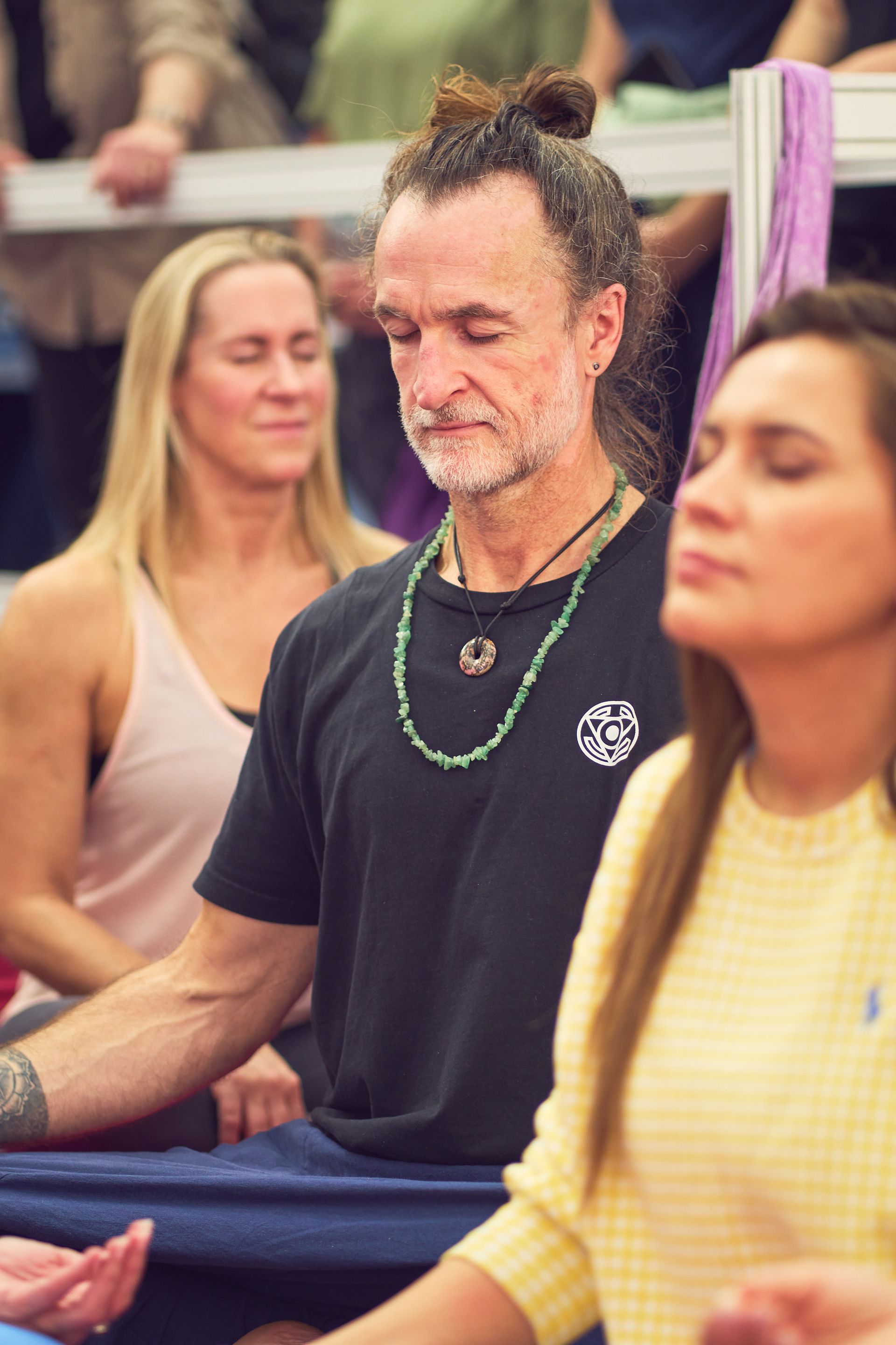 Visitors taking part in a meditation session at OM Yoga Show London