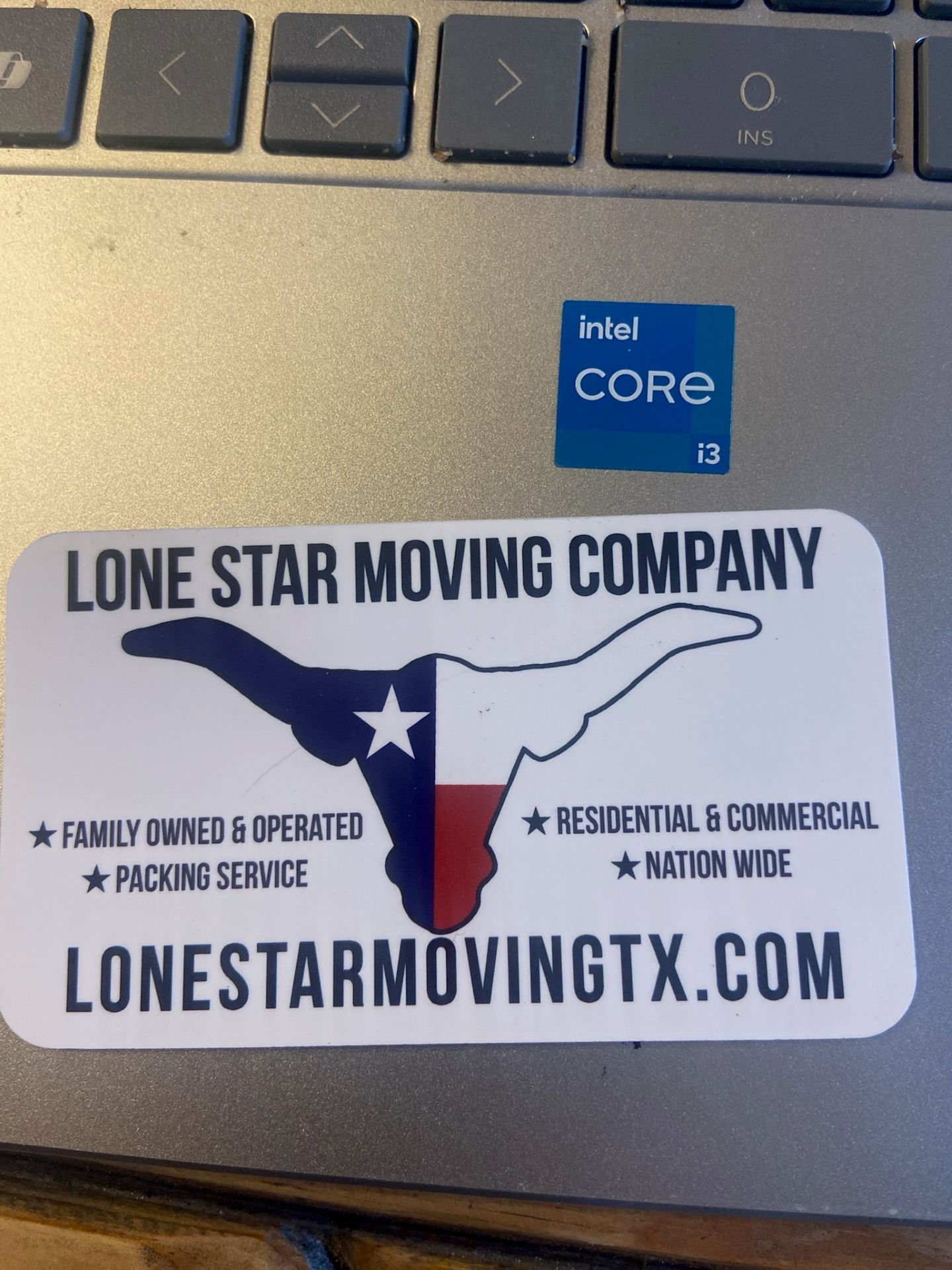 Lone Star Moving Company sticker with Texas map logo and lonestarmovingtx.com on a laptop