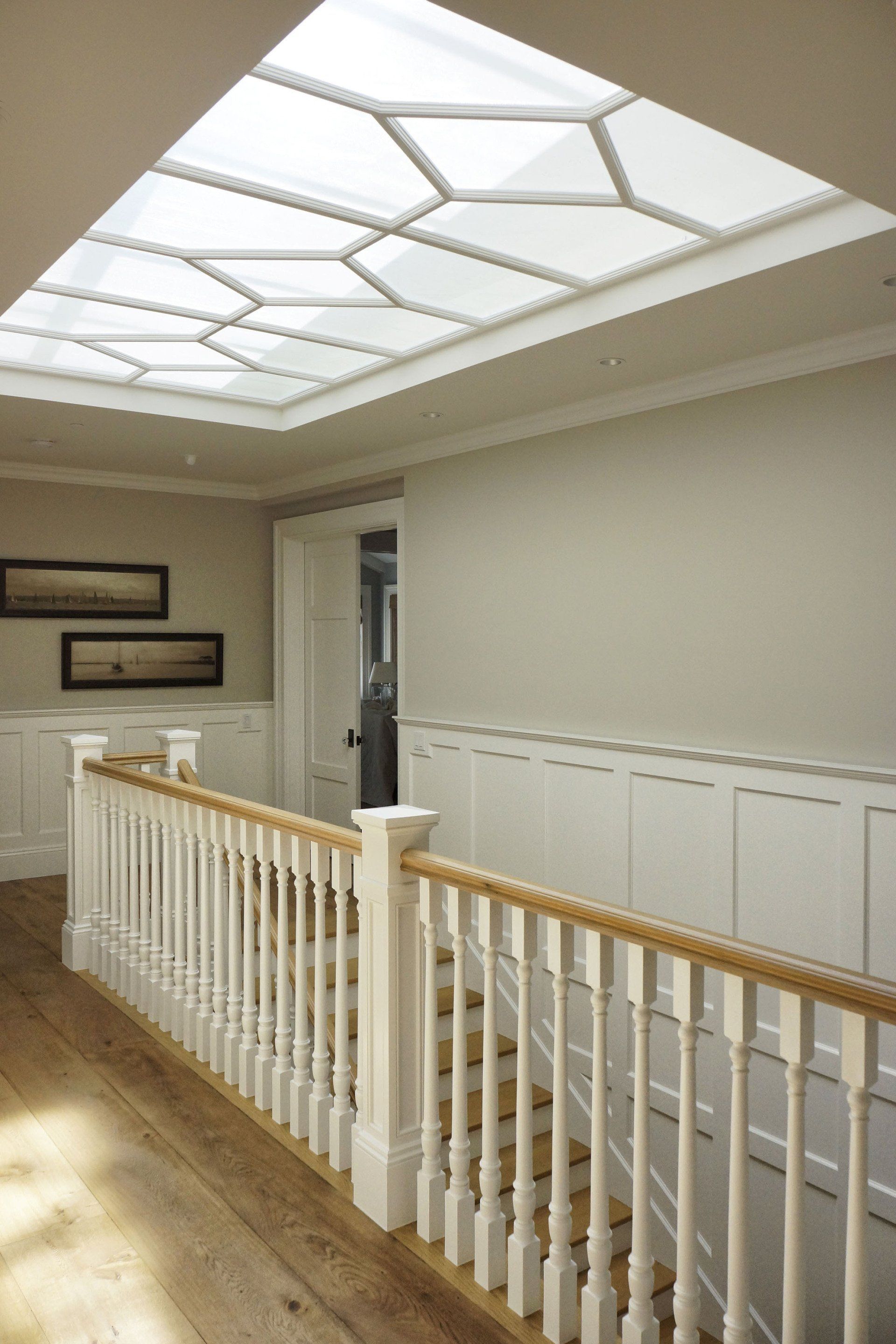 staircase landing in a Newport Beach house designed by Oatman Architects