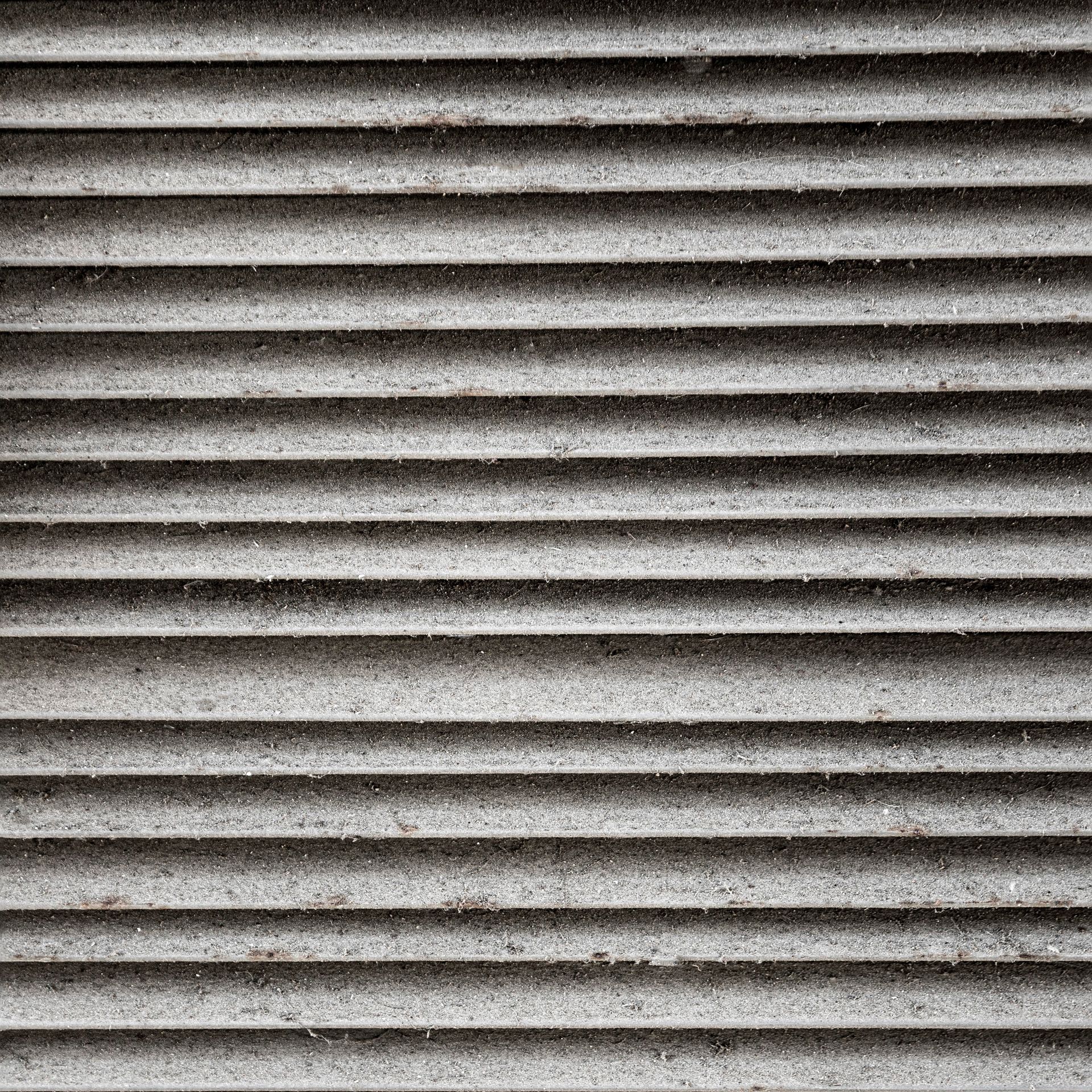 Close-up of a home air duct and vent being cleaned
