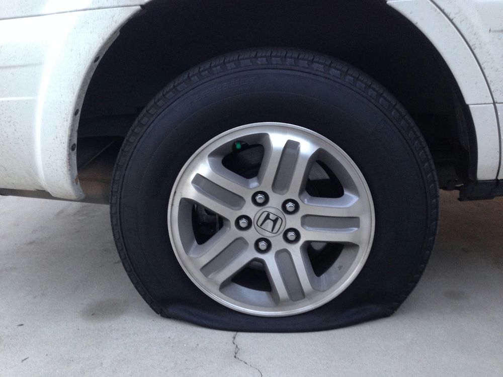 closeup of a car flat tire