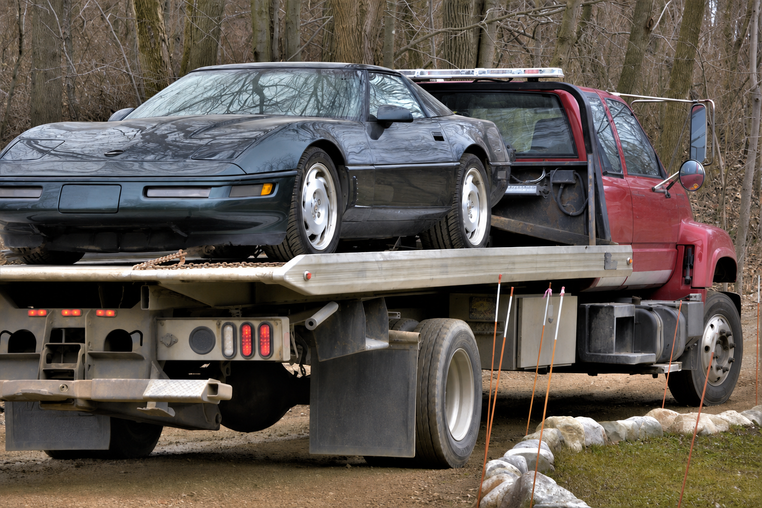 sports car on a flatbed tow truck