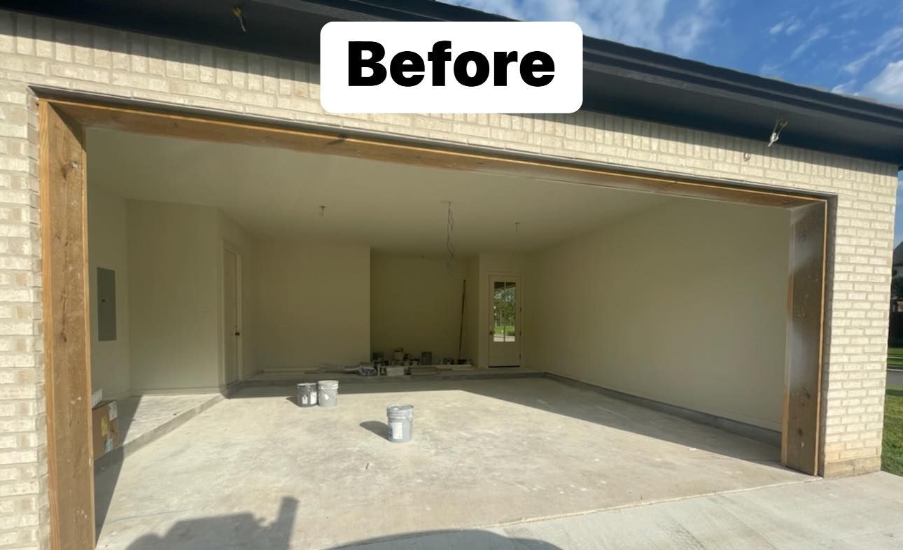 Garage interior before renovation, showing concrete floor, light-colored walls, and open door frame.