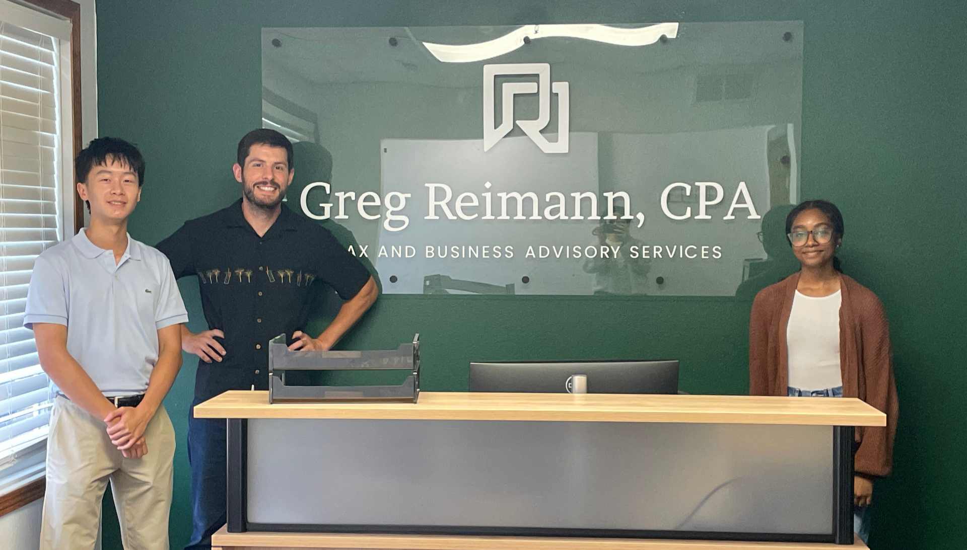 Iowa City area high school accounting interns and Greg at Greg Reimann, CPA offices in North Liberty