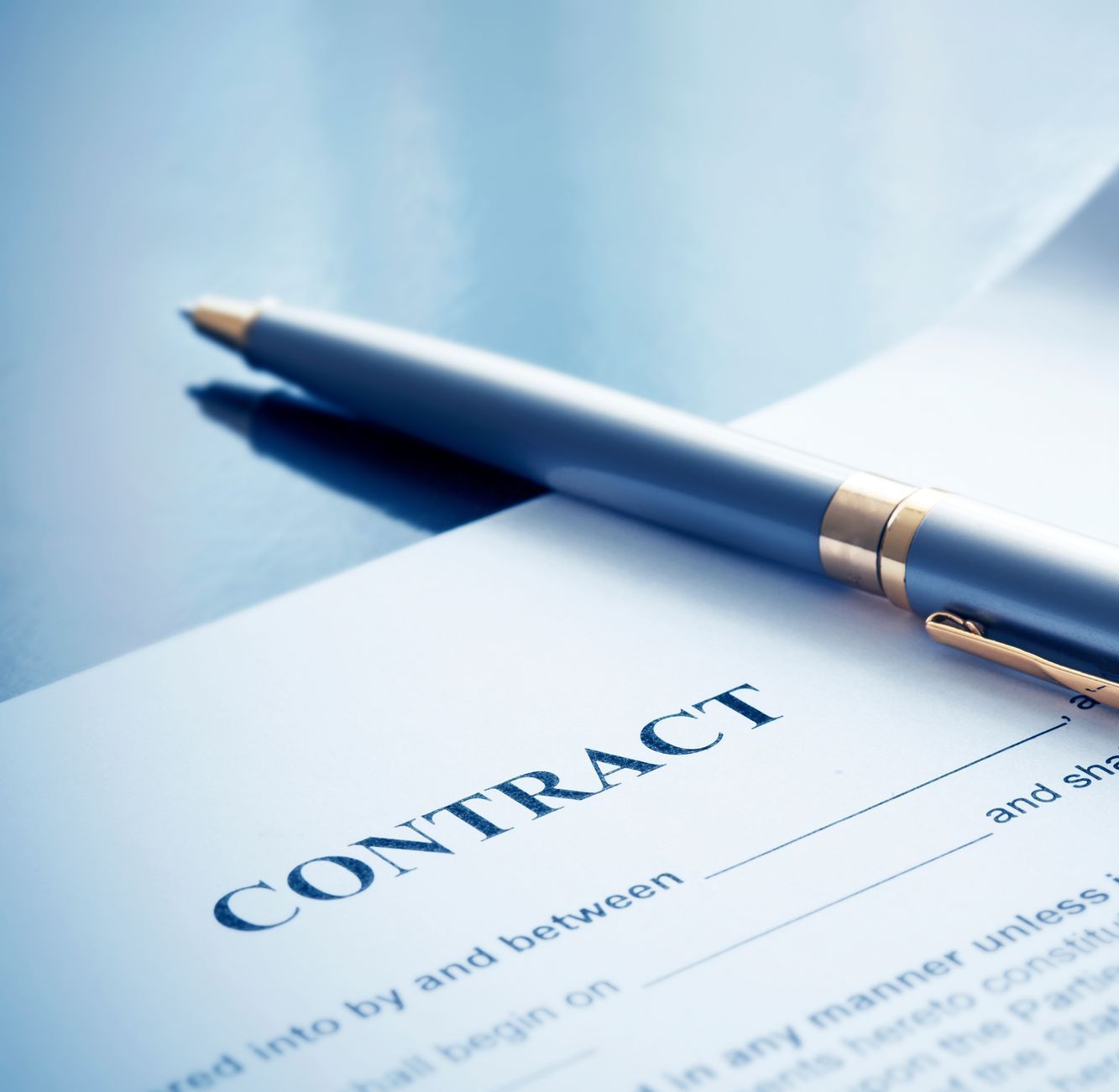 A pen is sitting on top of a contract