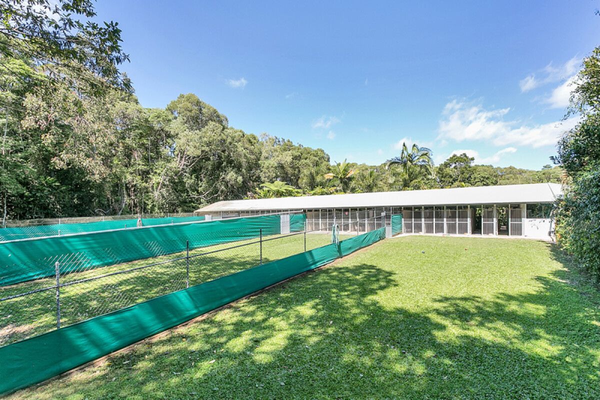 Exterior of a White Building With Several Outdoor Fenced-in Areas — Kuranda Pet Resort in Kuranda, QLD