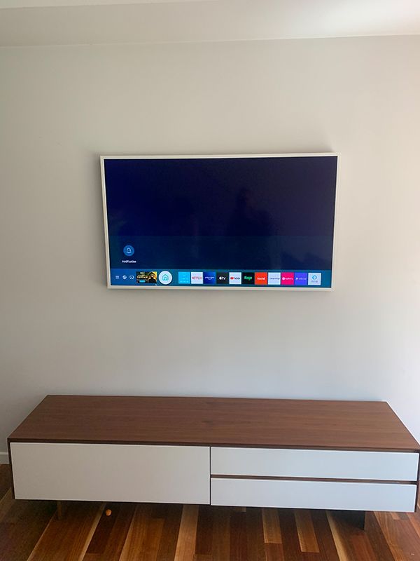 Flat Screen Tv Is Mounted On A Wall — Telecommunication Company In Denman Prospect, ACT