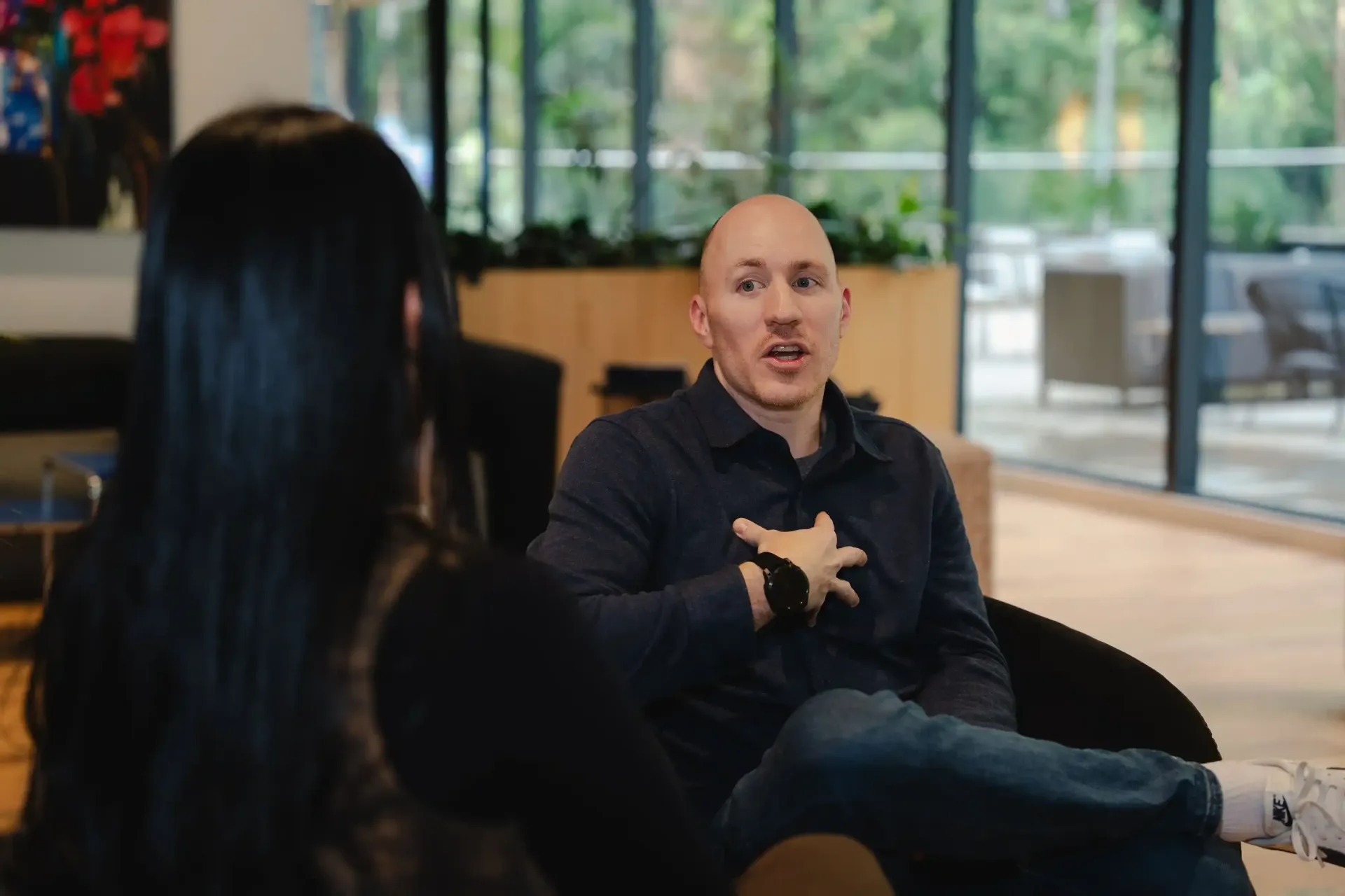 Career Coach Adam Broda Sitting Helping Client Tell Career Change Story