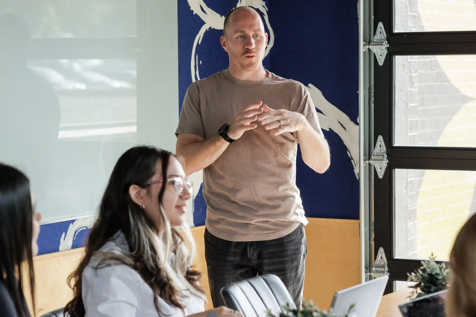 Career Coach Adam Broda Hosting Group Coaching Session In Small Classroom