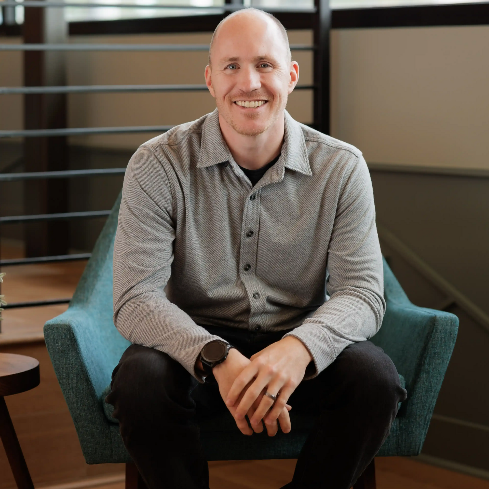 Career Coach Adam Broda Sitting On Chair Smiling Ready to Share 2026 Career Change Strategy