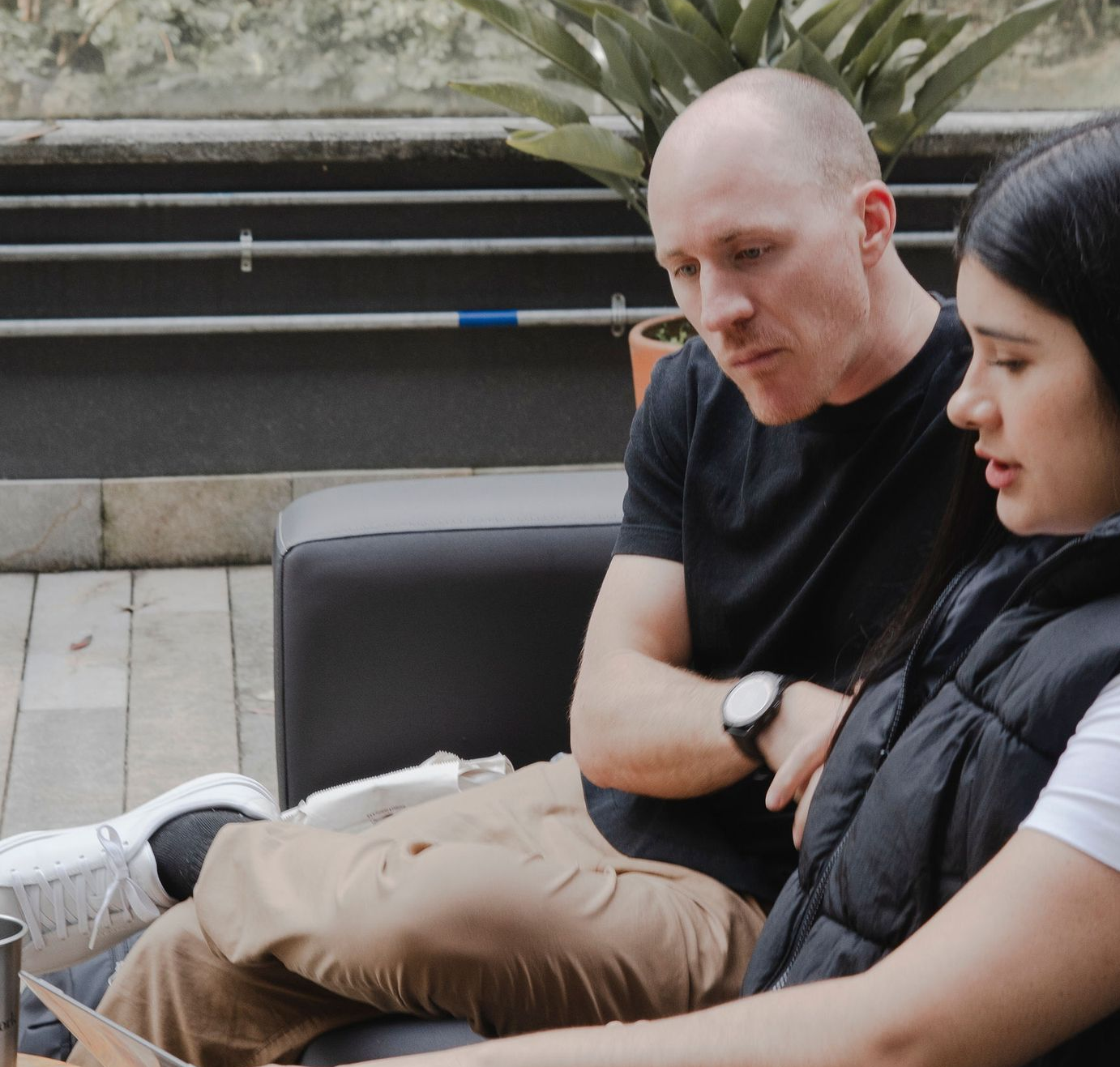 Career Coach Adam Broda Sitting Outside With Client Discussing How to Rebrand After Layoff