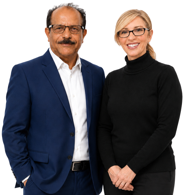 Two professionally dressed people posing against a white background, smiling at the camera.