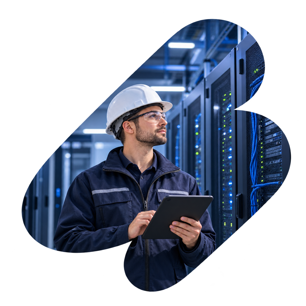 Construction worker in hard hat and reflective jacket using a laptop against a blue sky