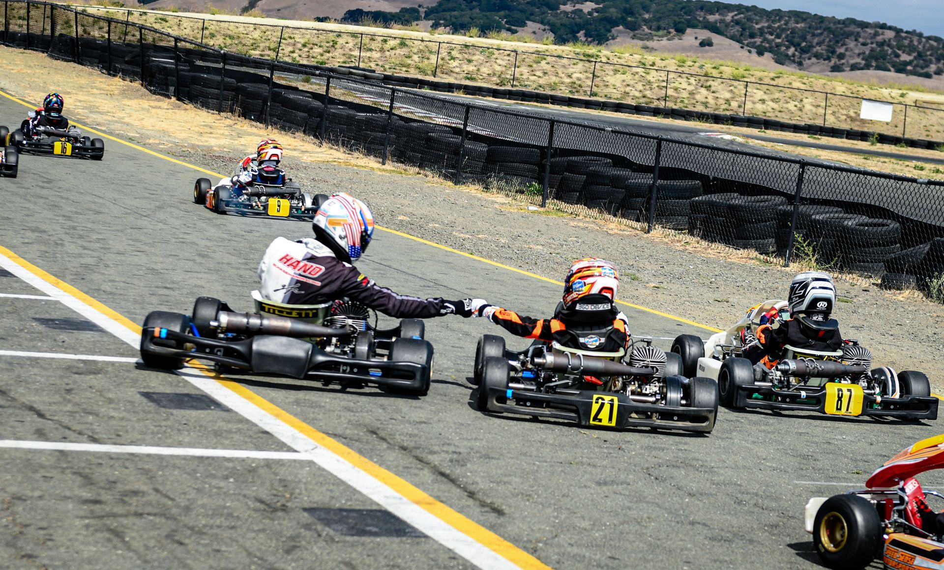 Kylo in his kart in the pits with his helmet on