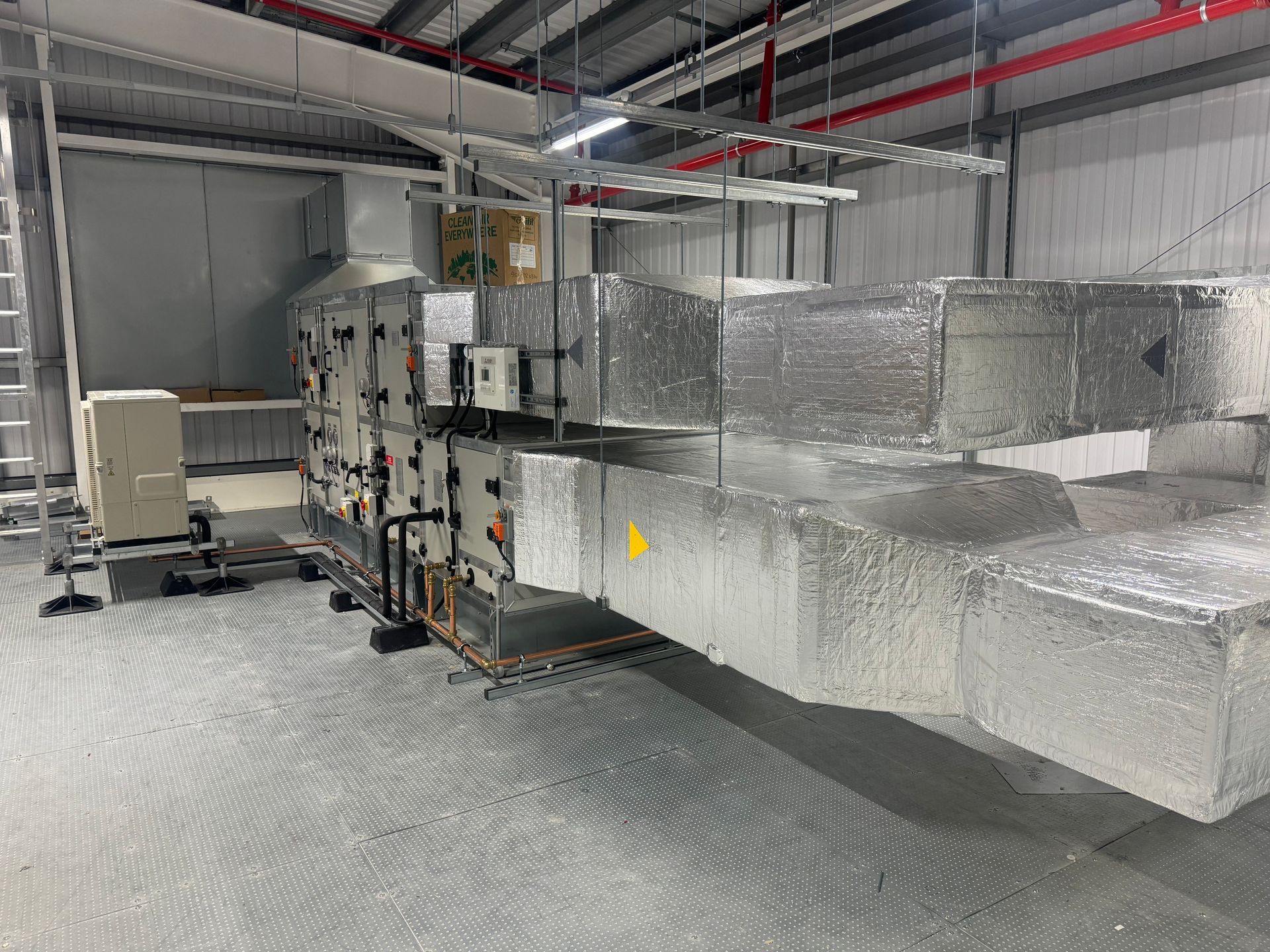 A large warehouse filled with lots of machinery and equipment.