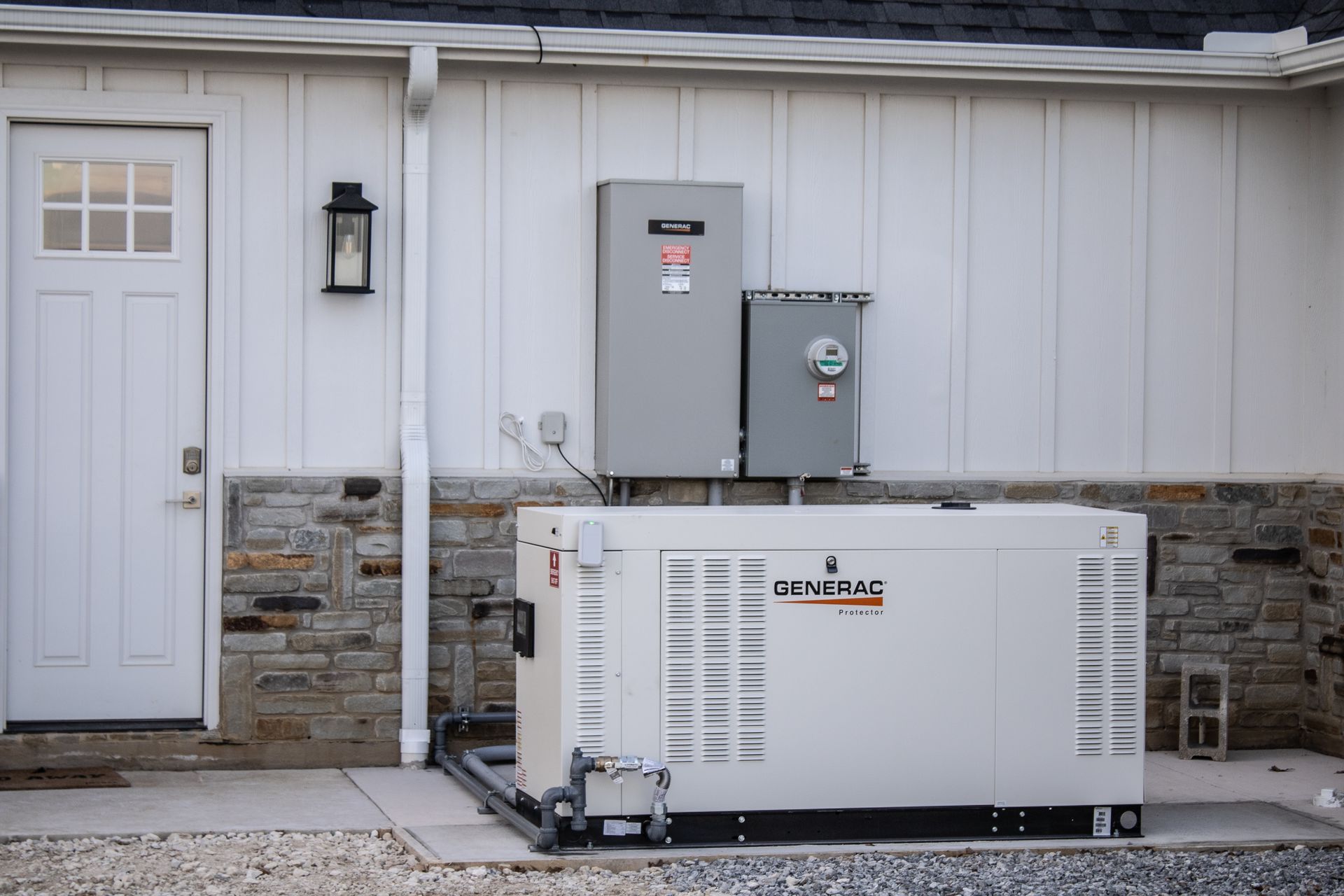 A Generac® generator installed outside a building by the expert team at Premier Generators of Texas 