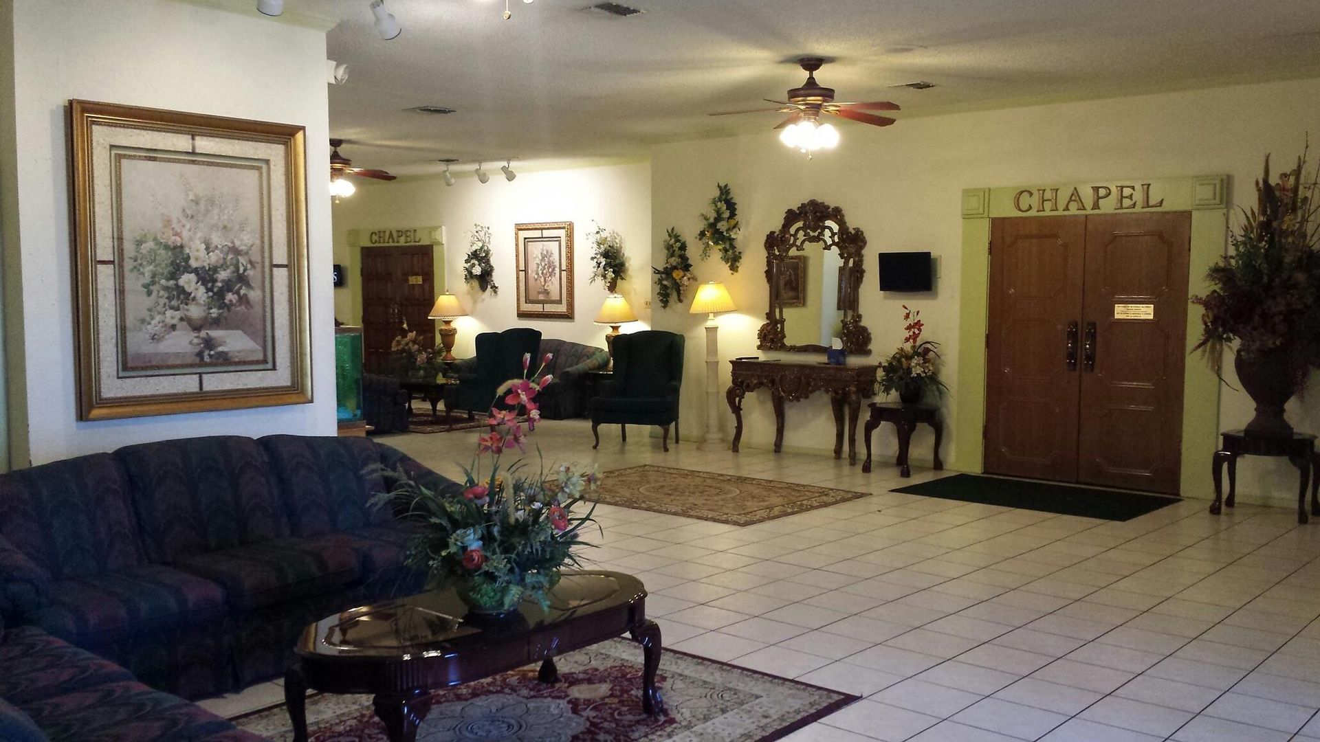 Lobby with a dark sofa, ornate furniture, and 
