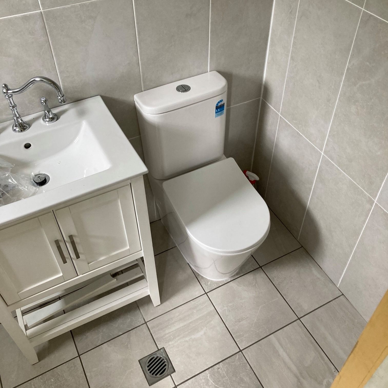 Installed toilet and sink in a newly renovated bathroom