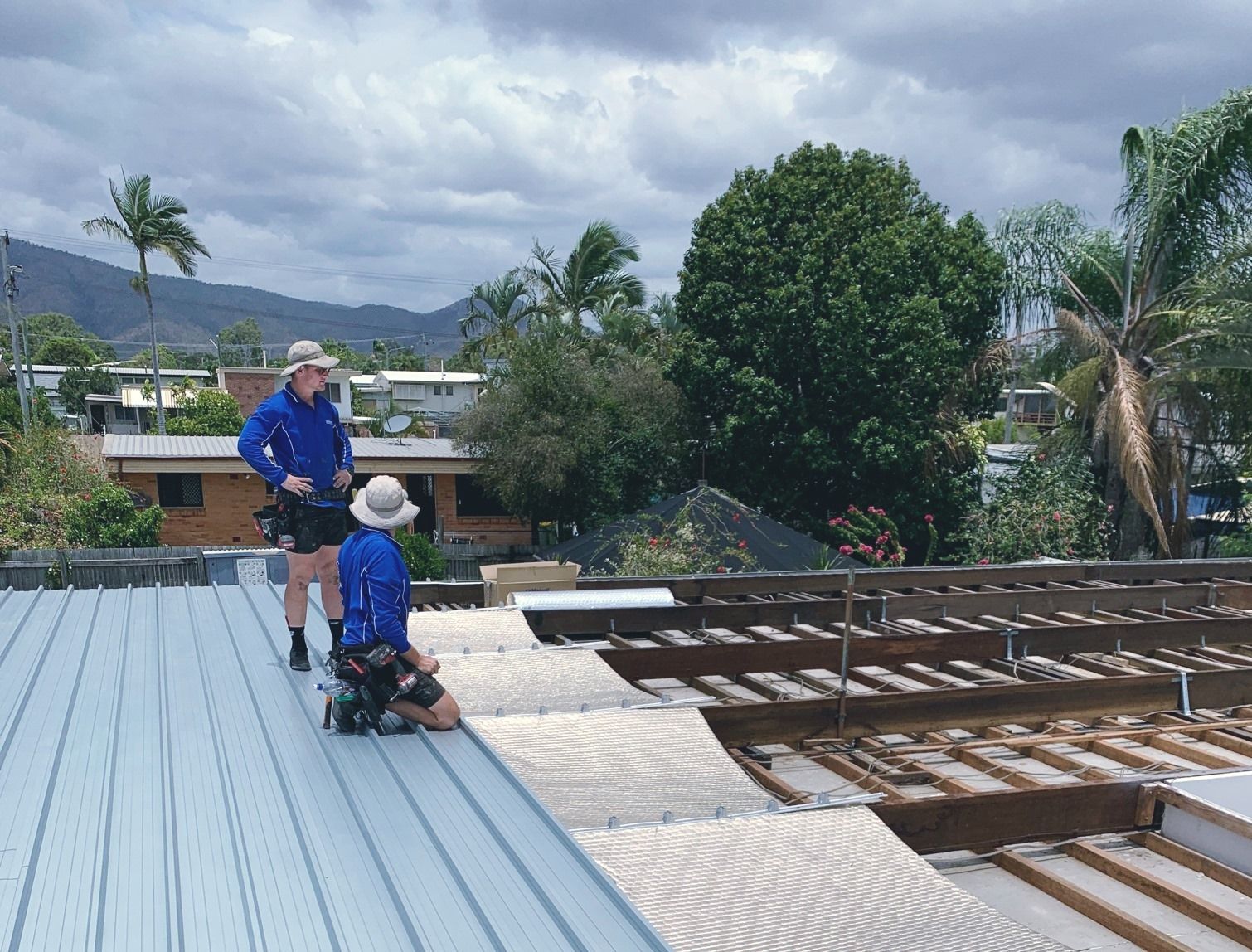 A team of workers engaged in a plumbing service with tools and equipment.