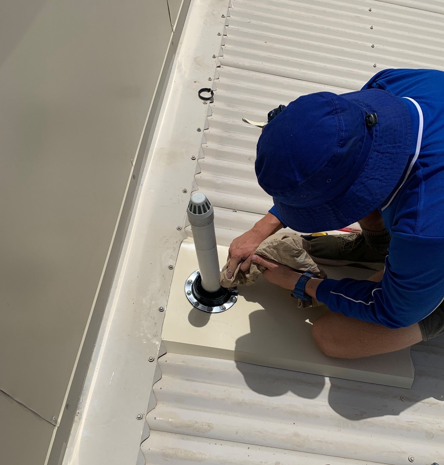 A group of plumbing professionals working together at a job site.