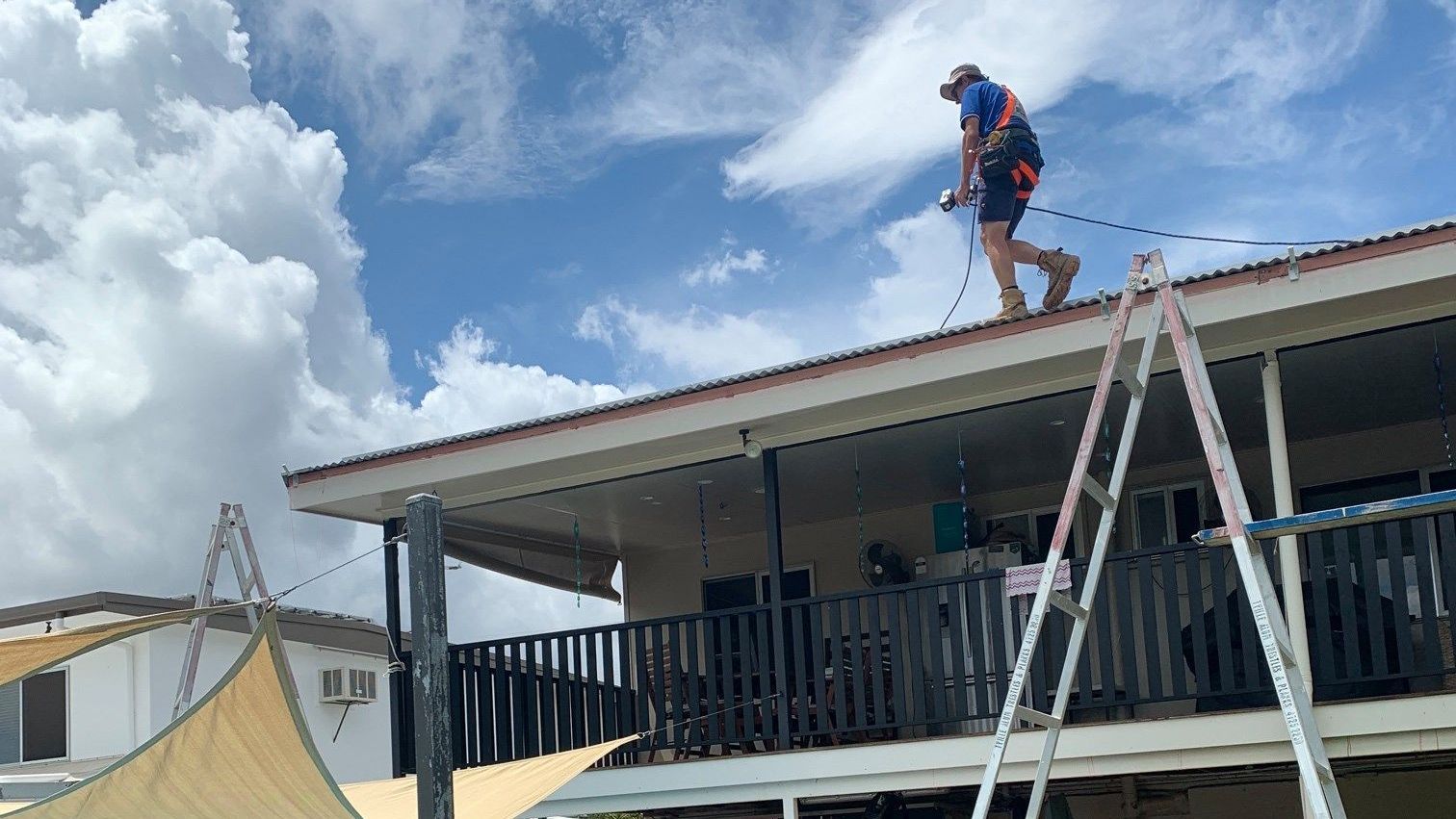 Plumbers collaborating on a job site to fix a plumbing issue.