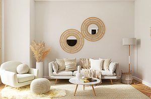 Minimalist beige living room with white chair, round mirrors, floor lamp, and low coffee table