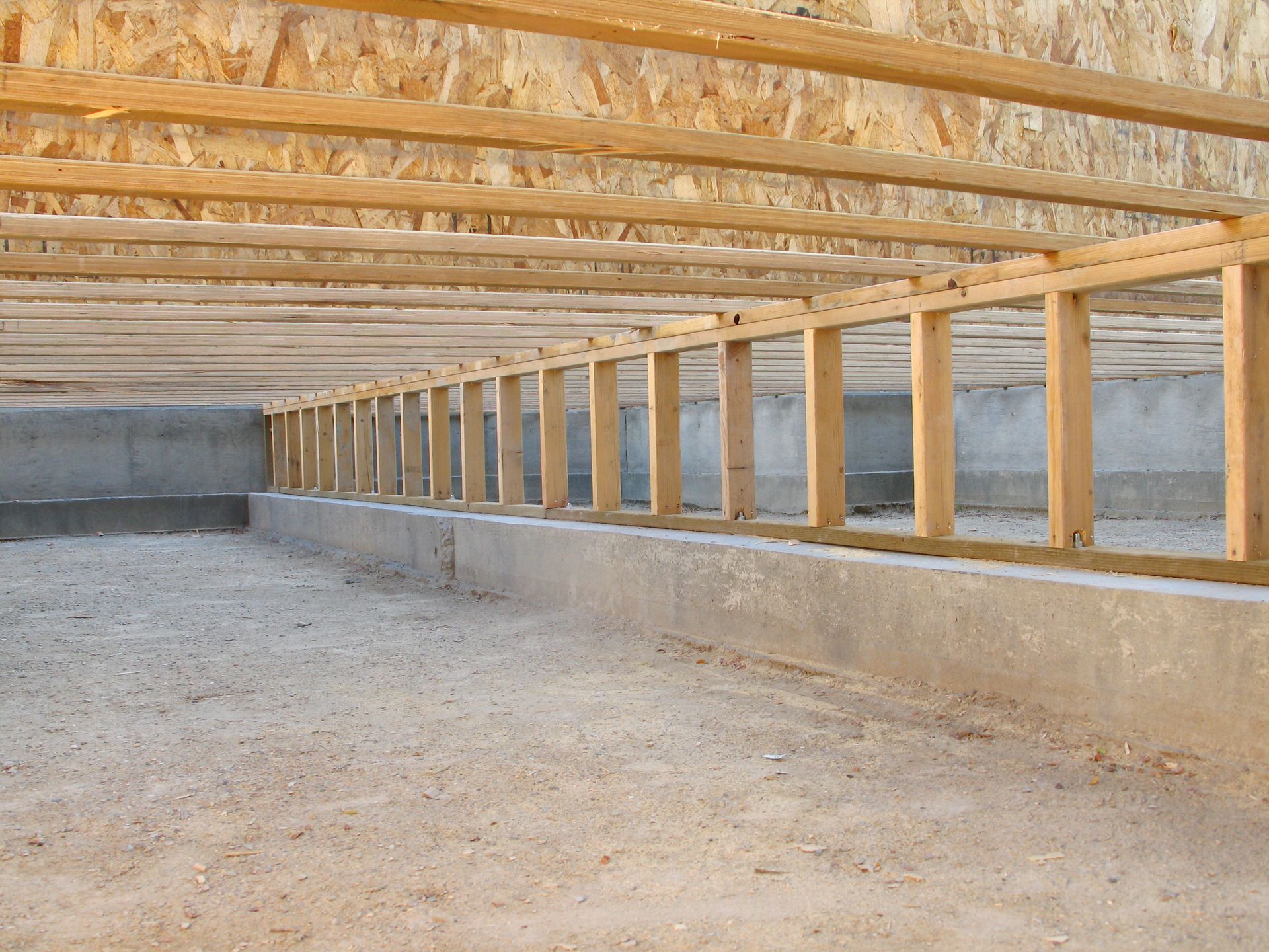 Construction Site: Neat Clean Crawlspace, Floor Joists, and Pony Wall Construction Site: Neat Clean Crawlspace, Floor Joists, and Pony Wall