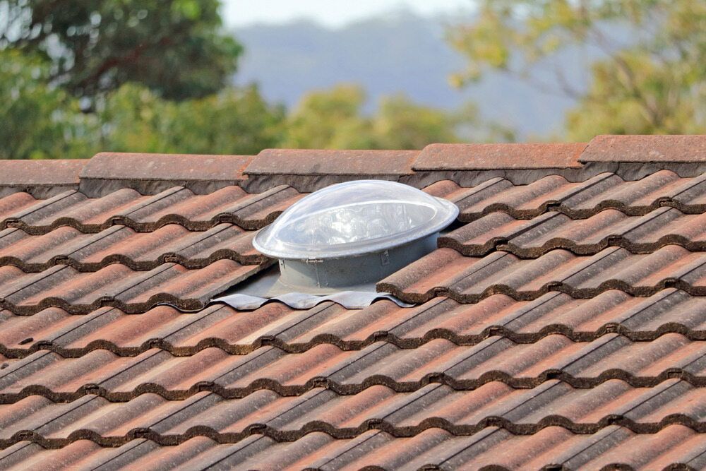 A Roof With a Skylight in the Middle of It — Bradshaw Plumbing & Roofing Pty Ltd In Paget, QLD