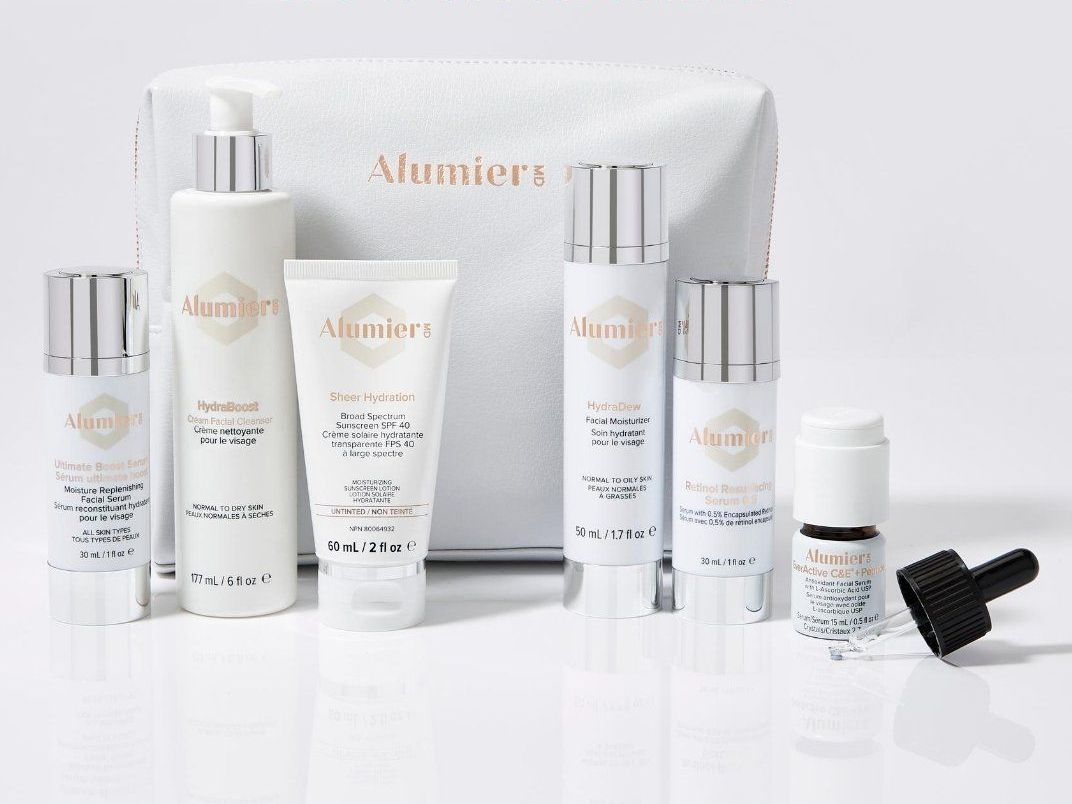 A white bag filled with a variety of cosmetic products.