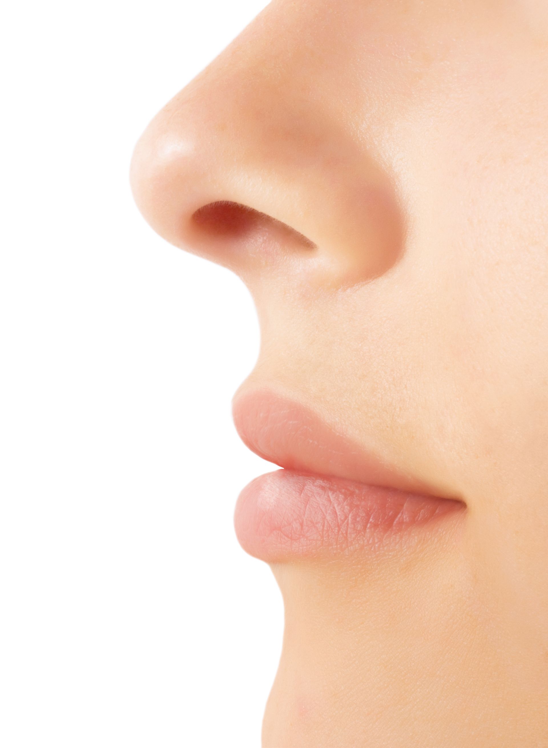 A close up of a woman 's nose and lips on a white background.