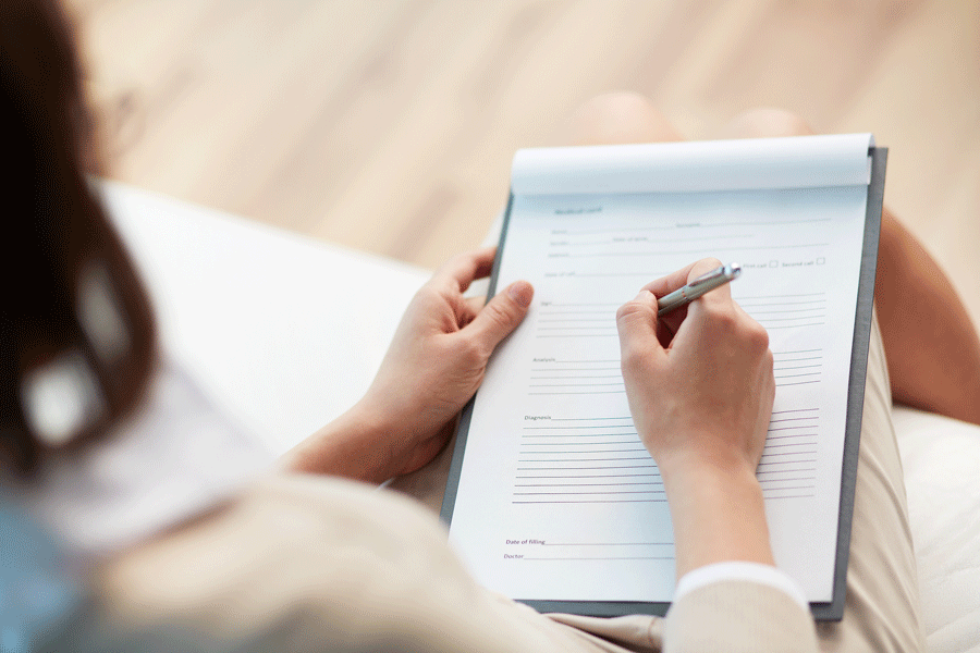 Filling Up Patient Form — Plymouth, MI — Leslie M Woodell DDS