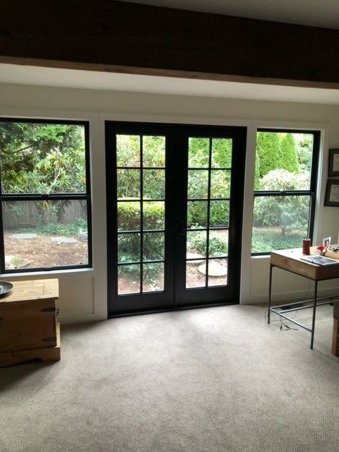 A room with a desk and a large window — Tukwila, WA — Bel-Red Windows & Doors