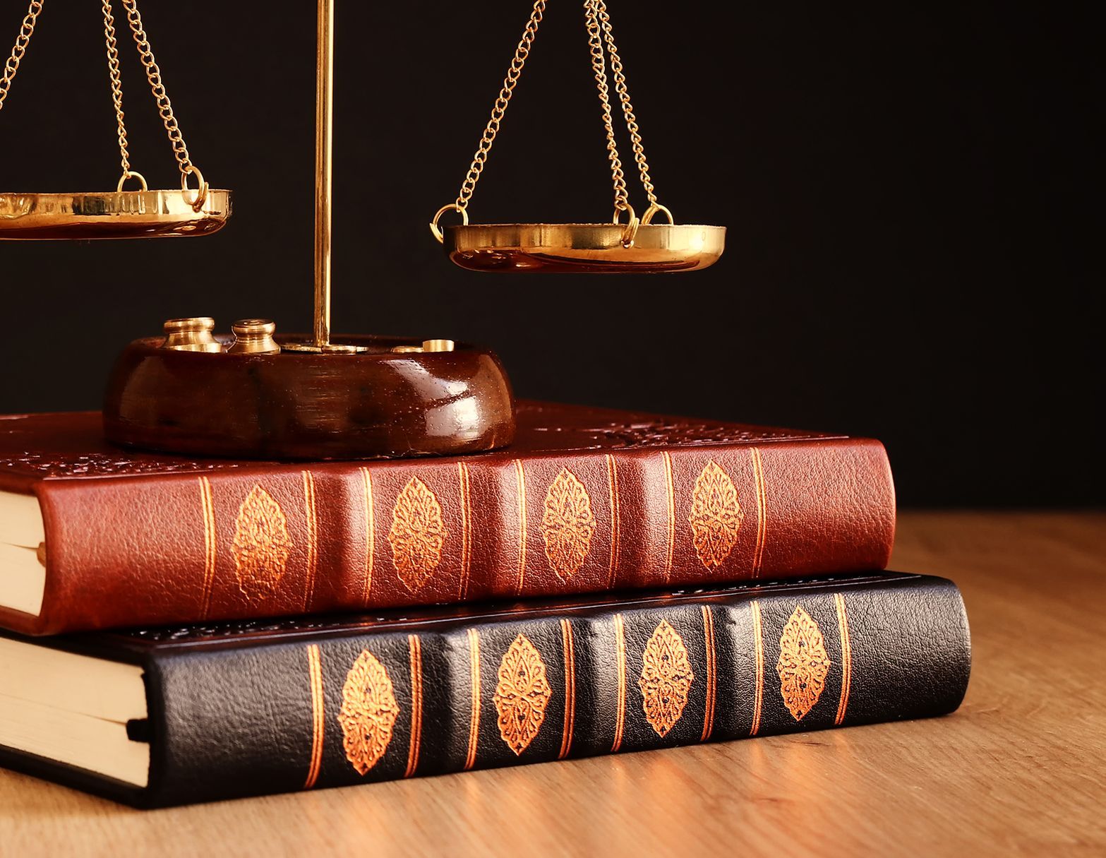 Scales of justice resting on law books.